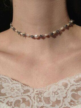 Vintage white pearl choker necklace with a small silver chain